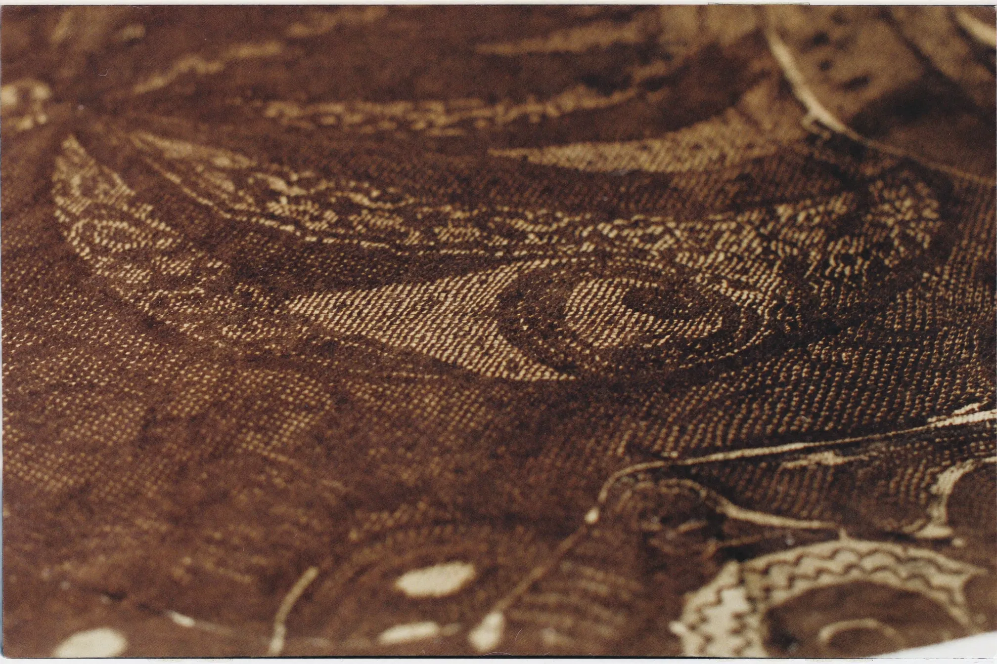 Detail of hand-drawn batik wax lines on cloth